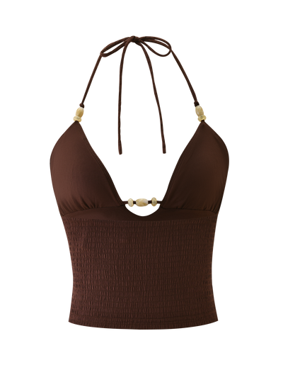 The ZINNIA TOP - CHOCOLATE by TIGERMIST is a chocolate brown halter cami crop top with a deep V neckline, beige bead details on the straps and front, and a smocked textured knit lower section.