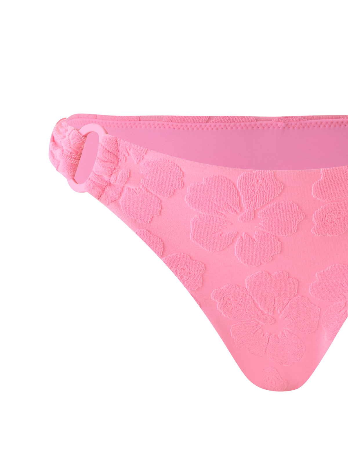 The FIORA BIKINI BOTTOM - BABY PINK by TIGERMIST features floral embossing, cheeky coverage, and a decorative ring on the side.