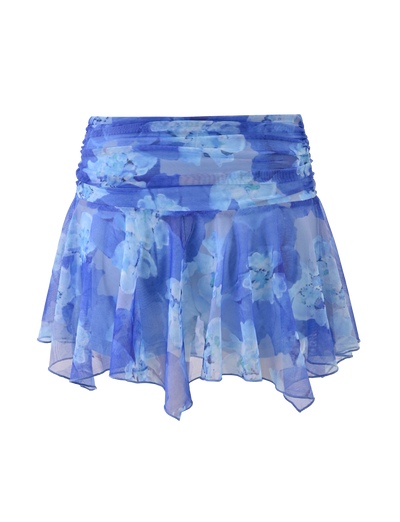 The DEVYN MINI SKORT by TIGERMIST is a sheer, flowy mini skort in blue macro floral. It features a mid rise, slightly gathered waistband, and a stylish handkerchief hem for a chic look.