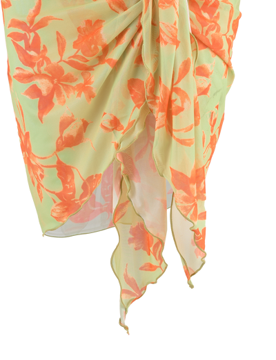A sheer light green sarong with orange floral prints and an asymmetrical hem, draped at the waist—perfect to pair with the TIGERMIST AVE 2PC BIKINI BOTTOM - POP FLORAL.