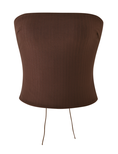 The TIGERMIST GWENDOLINE TOP - CHOCOLATE is a brown, ribbed strapless top with a fitted, textured stripe design, open back, and two thin strings hanging from the bottom hem, shown on a plain white background.
