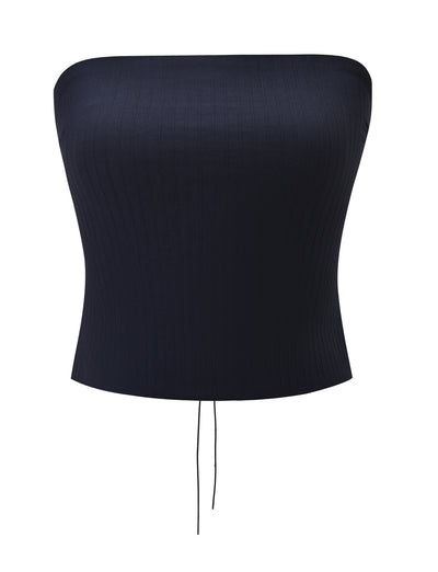 Introducing the GWENDOLINE TOP - NAVY by TIGERMIST: a strapless, fitted tube top in navy with subtle vertical textured stripes, featuring a chic lace-up back and two thin drawstrings at the bottom center.