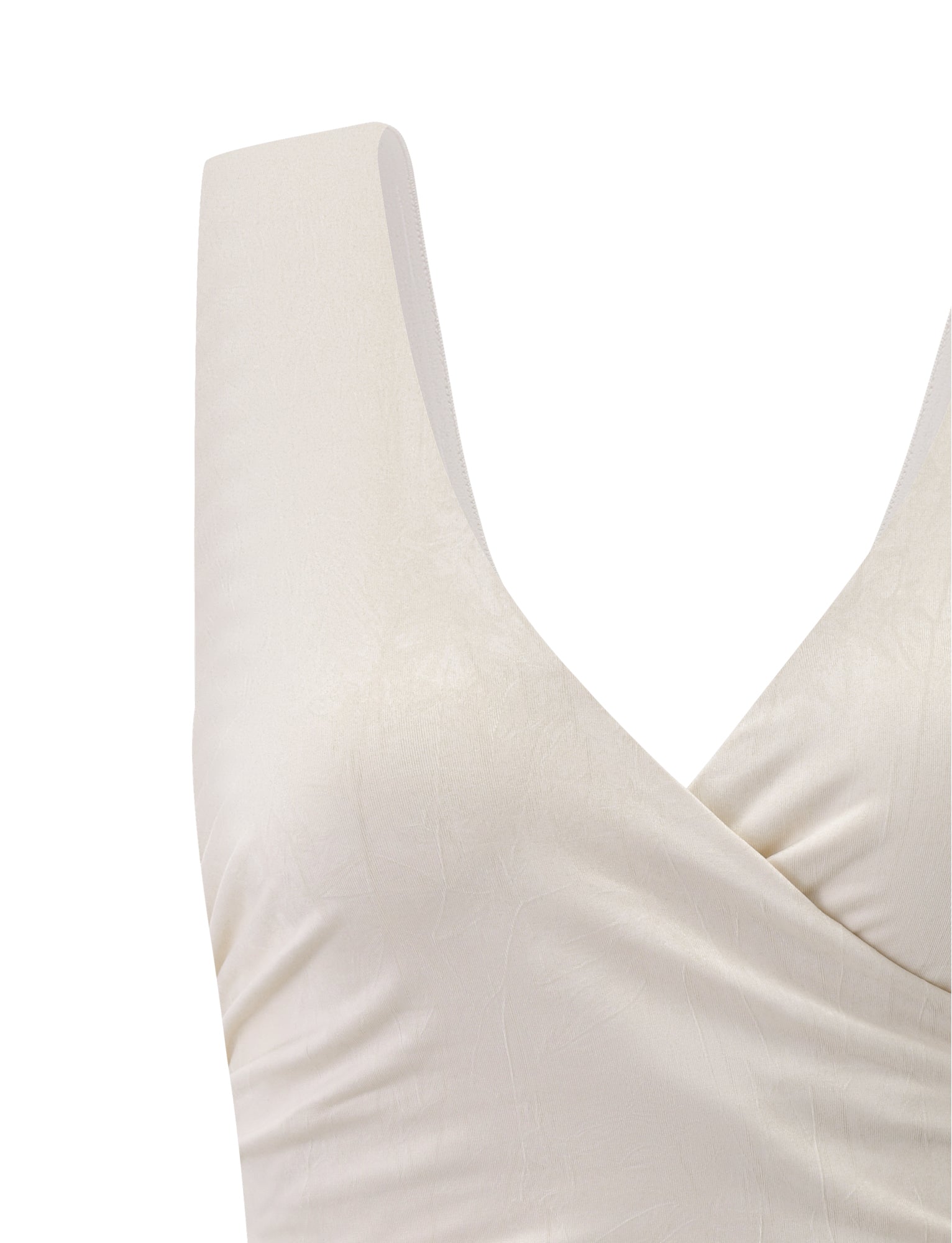 Close-up of the TIGERMIST NURA TOP in ivory, featuring wide shoulder straps, a V-neckline, and subtly textured fabric. Only the upper portion of this sleeveless top is visible.