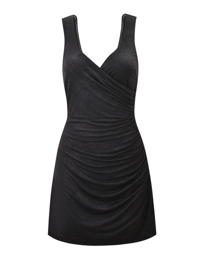 The NURA MINI DRESS - BLACK by TIGERMIST is a sleeveless, fitted mini dress featuring a V-neckline, side ruching, smooth shiny fabric, and a chic open back for added allure.