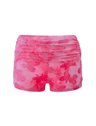 The PATRIZIA SHORT - PINK BUTTERFLY by TIGERMIST features high-waisted pink mesh with ruched detailing, embroidered floral patterns, and a delicate butterfly applique for a playful touch.