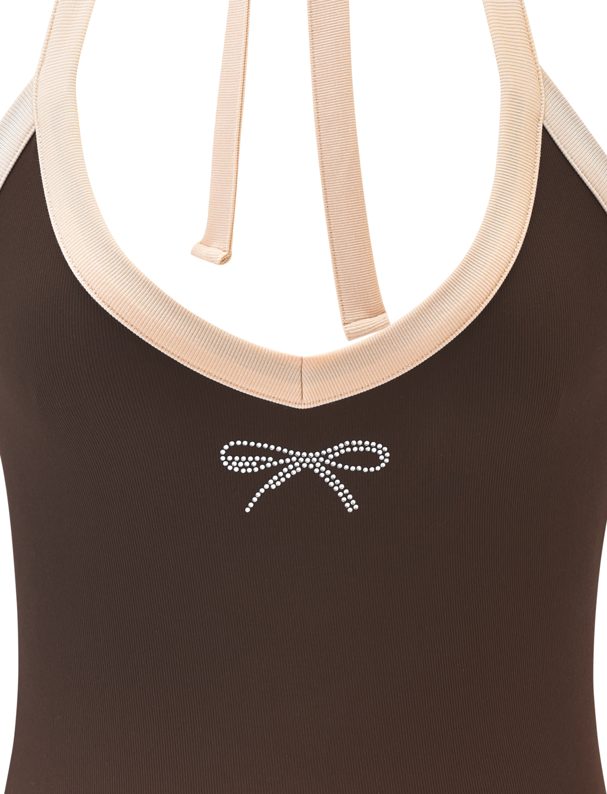 Close-up of the TIGERMIST ALYSIA TOP - CHOCOLATE, featuring a halter neck with light beige trim, ribbed ties, and a small white dotted bow printed below the neckline.