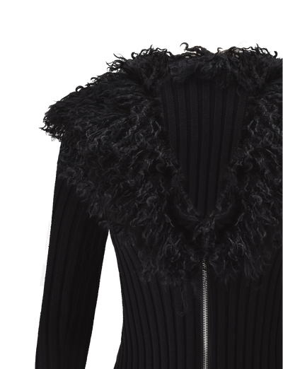 A close-up of the TIGERMIST BRISA JUMPER in black, showcasing its ribbed design, silver zipper, and large fluffy faux fur collar against a white background.