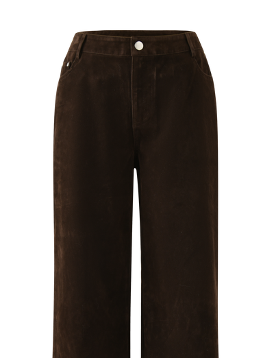 The TIGERMIST CAMELLIA PANT - CHOCOLATE SUEDE features a high waist, wide-leg silhouette, vintage-inspired details, front button and zip closure, two side pockets, and belt loops in a rich chocolate suede finish.