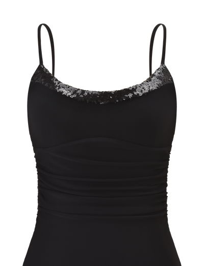 The ELYSIUM MINI DRESS by TIGERMIST is a black mesh mini dress featuring thin straps, ruched sides, and a scoop neckline adorned with black and silver sequins.