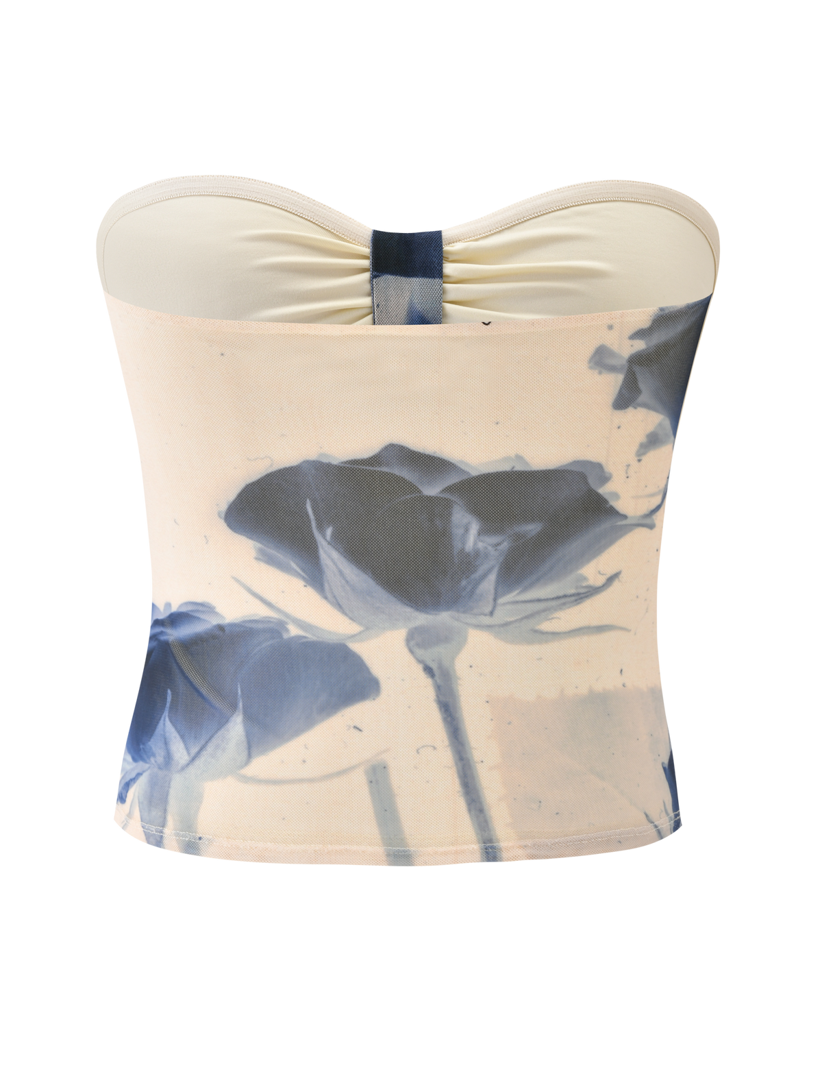 The JANIS TOP - INDIGO FLORAL by TIGERMIST is a strapless beige tube top with a center knot, bold blue rose print, and an artistic floral mesh design on the front.