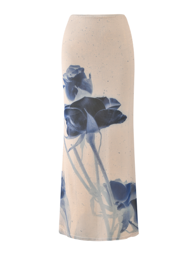 The TIGERMIST JANIS MAXI SKIRT in Indigo Floral features a cream base with large blue floral prints, shown against a plain background.