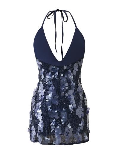 The ZANA MINI DRESS - NAVY SEQUIN by TIGERMIST features a halter neck, plunging neckline, and shimmering blue sequins with a fitted bodice and flowing sequin accents.