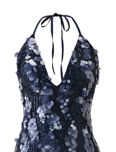 The TIGERMIST ZANA MINI DRESS - NAVY SEQUIN features a halter neck, plunging neckline, tied ribbon straps, and bold silver and blue sequins for a stunning look.