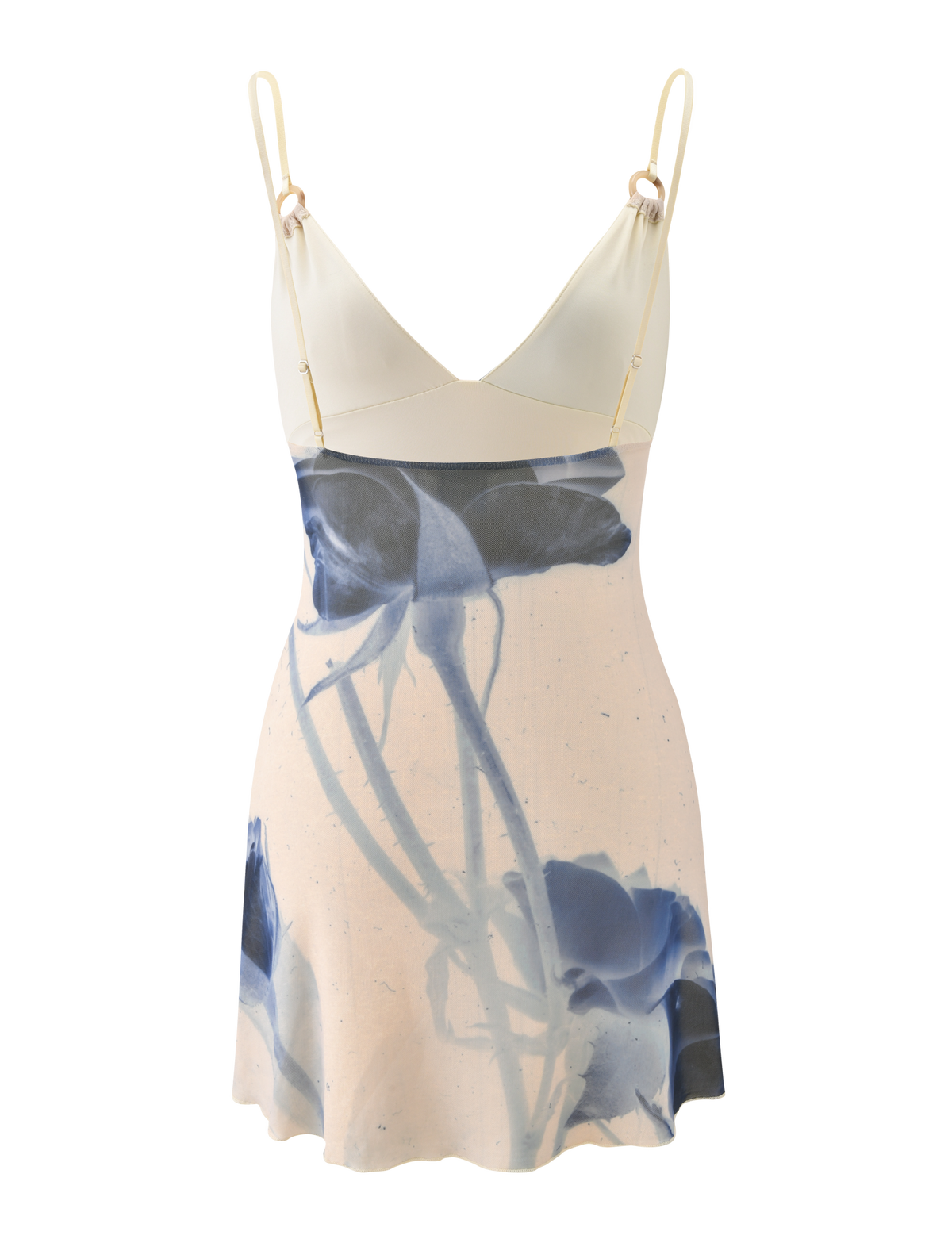 The TIGERMIST ROSY MINI DRESS - INDIGO FLORAL is a sleeveless cream mini dress with adjustable cami straps, a V-neckline, and a bold blue abstract rose print for a fresh, modern style.