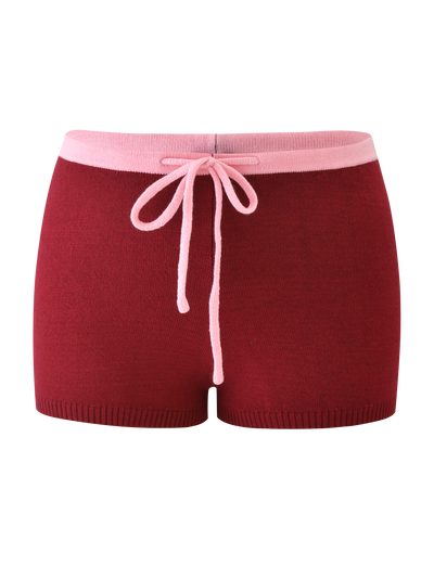 The ROUX SHORT - RED by TIGERMIST features a red knit design with a light pink waistband and matching drawstring, shown against a plain white background.