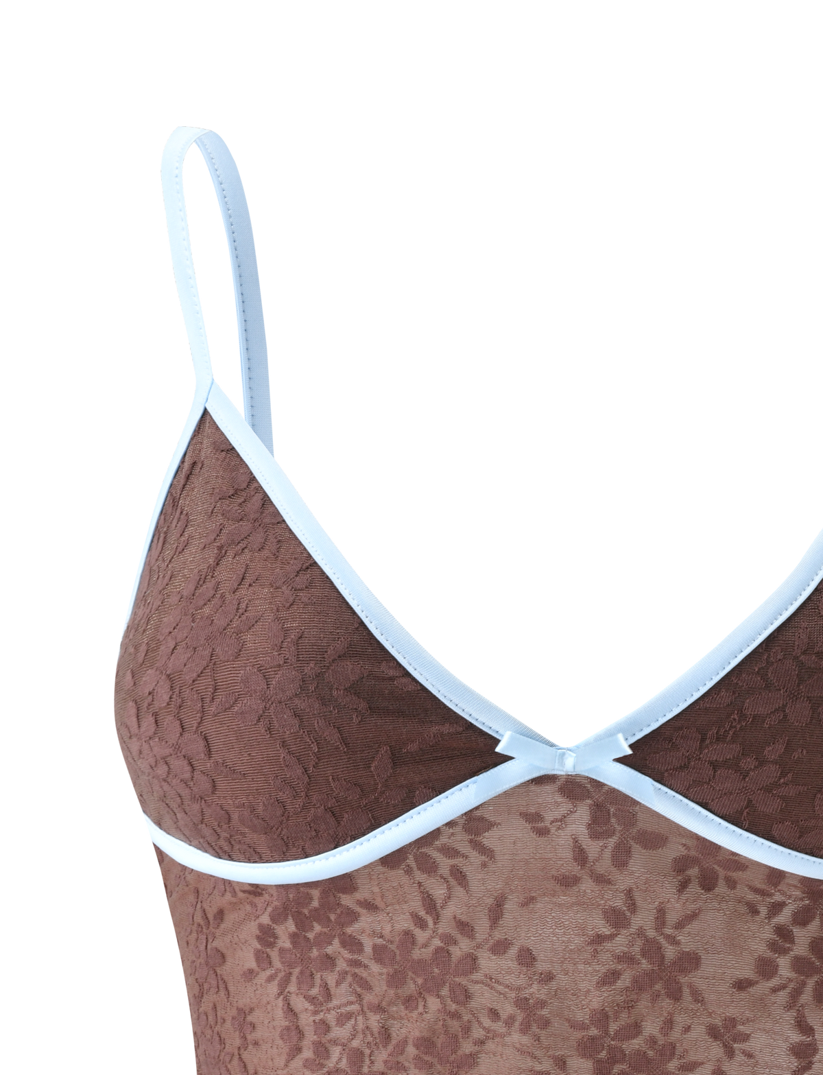 Close-up of the TIGERMIST AUBURN TOP - CHOCOLATE, a brown lace cami with white trim, adjustable straps, delicate floral pattern, and a small decorative accent at the center neckline.