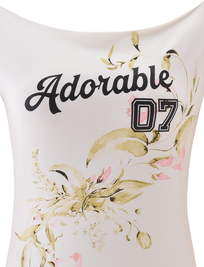 The FYNN TEE - WHITE by TIGERMIST is an off-shoulder baseball top featuring “Adorable 07” in bold script with a floral design of green leaves and pink flowers for a charming accent.