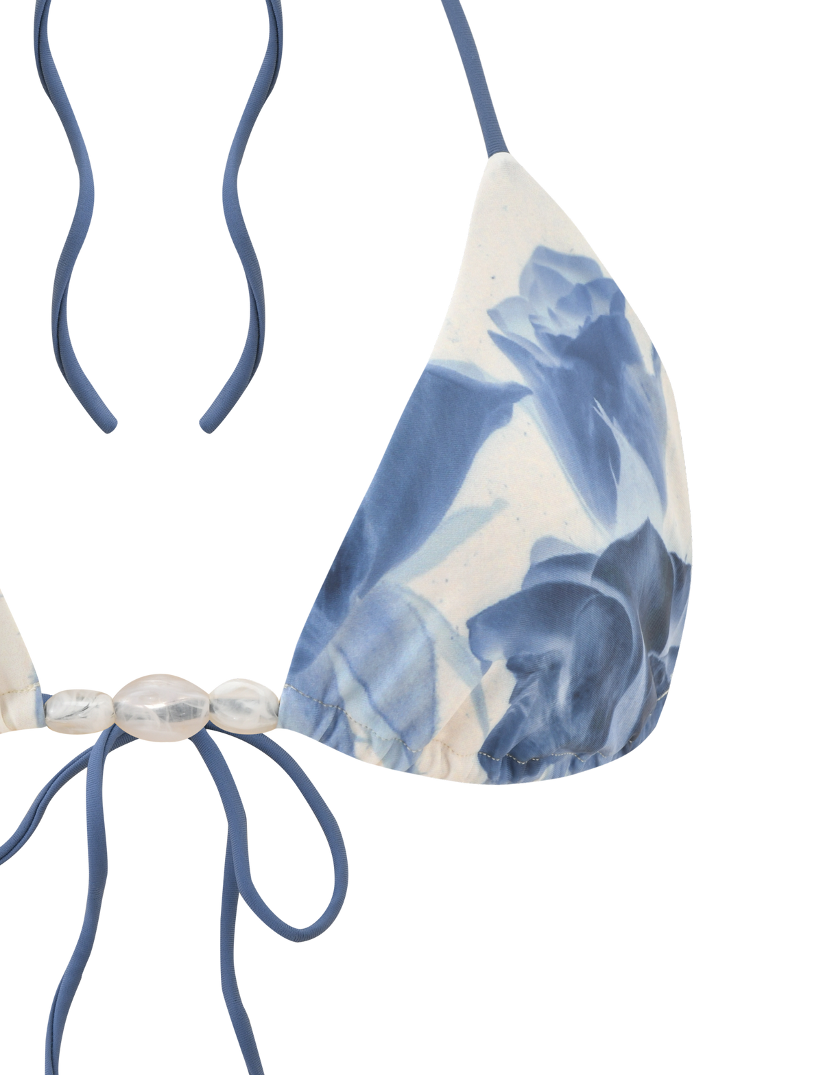 The TIGERMIST CYLAS BIKINI TOP in Indigo Floral features a halter neck, blue straps, blue and white floral design, and decorative translucent beads at the center.