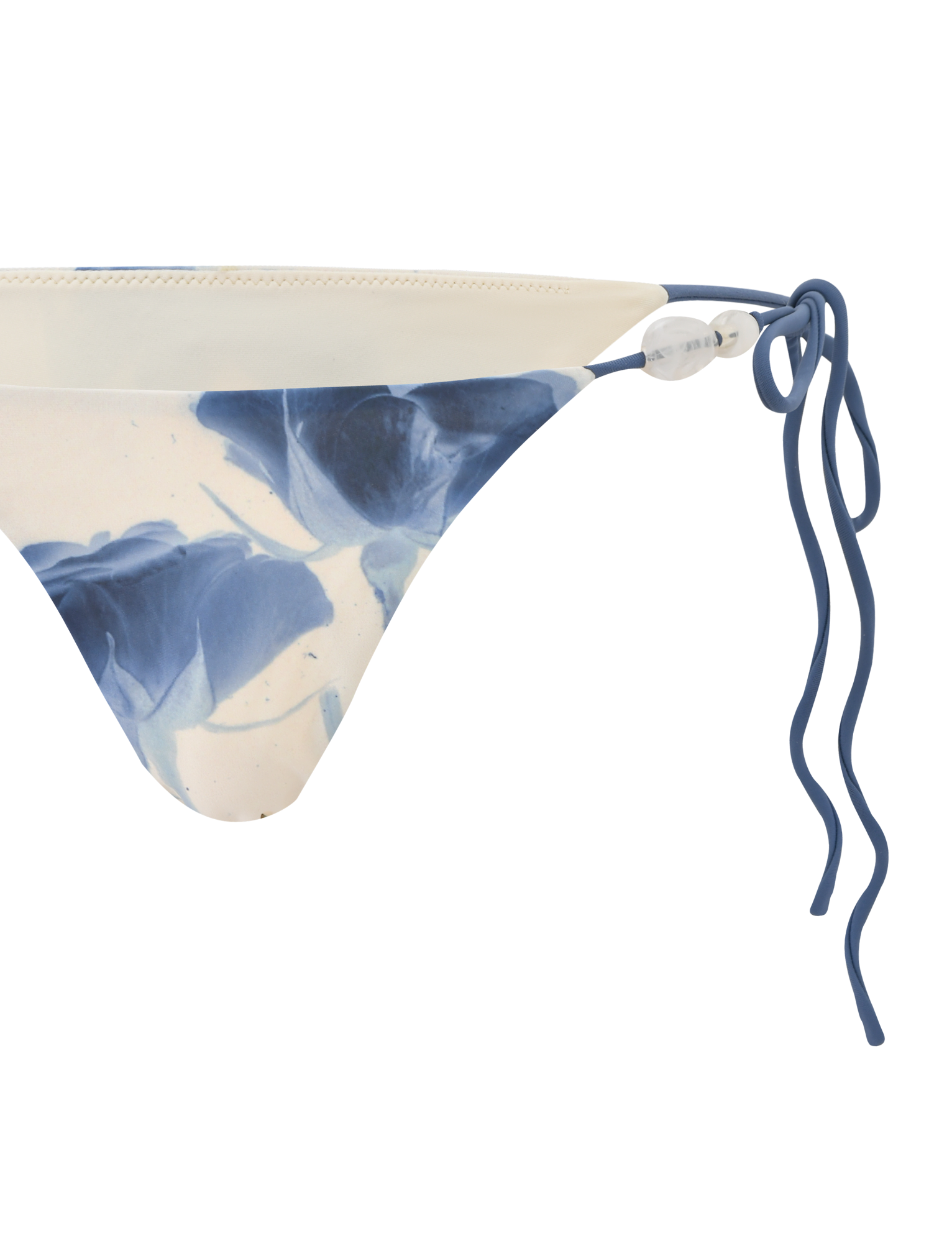 A close-up of the TIGERMIST CYLAS BIKINI BOTTOM in Indigo Floral, featuring blue and white rose print on the left side, set against a white background.