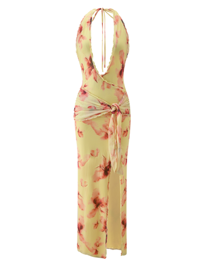 The ALLEGRA MAXI DRESS by TIGERMIST features a yellow watercolour floral print, sleeveless plunging halter neckline, ruched sides, sash waist, and a high leg split for allure.