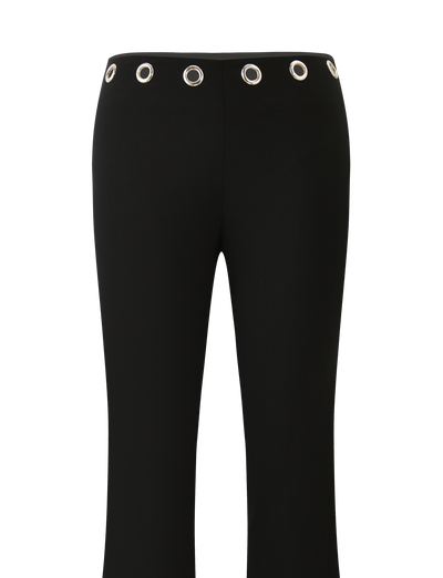 The TIGERMIST MARREN PANT - BLACK features a straight fit, low-rise waist, and bold silver grommets evenly spaced around the waistband. Shown against a plain white background.