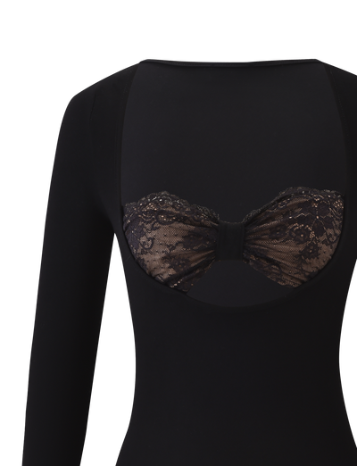 The TIGERMIST DAMELA LONG SLEEVE TOP in black features a low-cut back with a floral lace bandeau detail, creating a striking contrast against the solid fabric for a subtly alluring and versatile look.