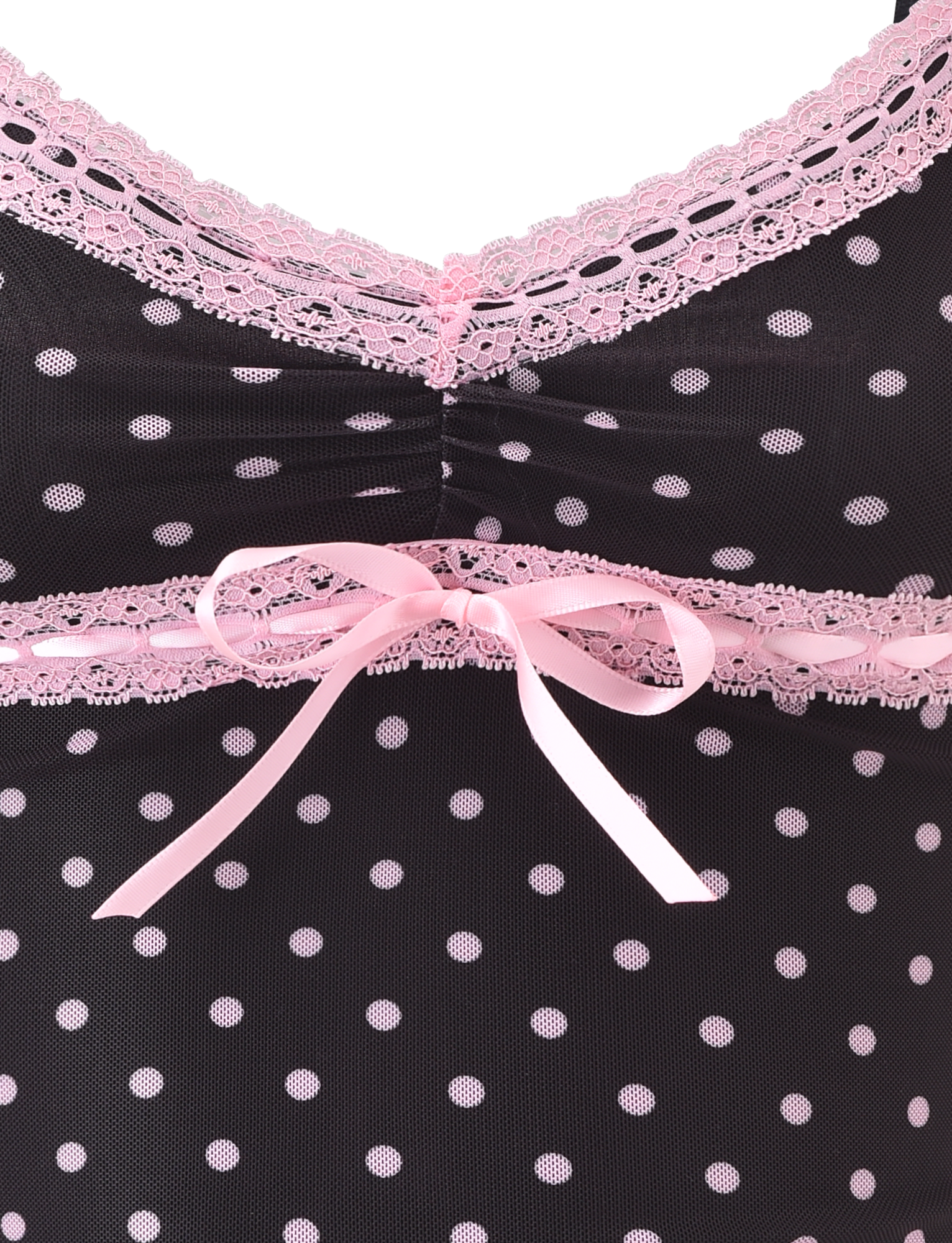 Close-up of the AMARA TOP - BLACK by TIGERMIST, featuring black fabric with polka dots, pink lace trim, and a pink ribbon bow at the center.