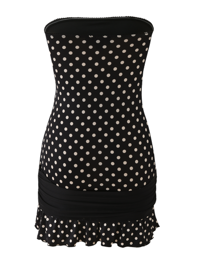 The TOVE MINI DRESS by TIGERMIST features a bodycon strapless design in black polka dot, with a ruched band at the lower hips and a playful ruffle hem for extra flair.