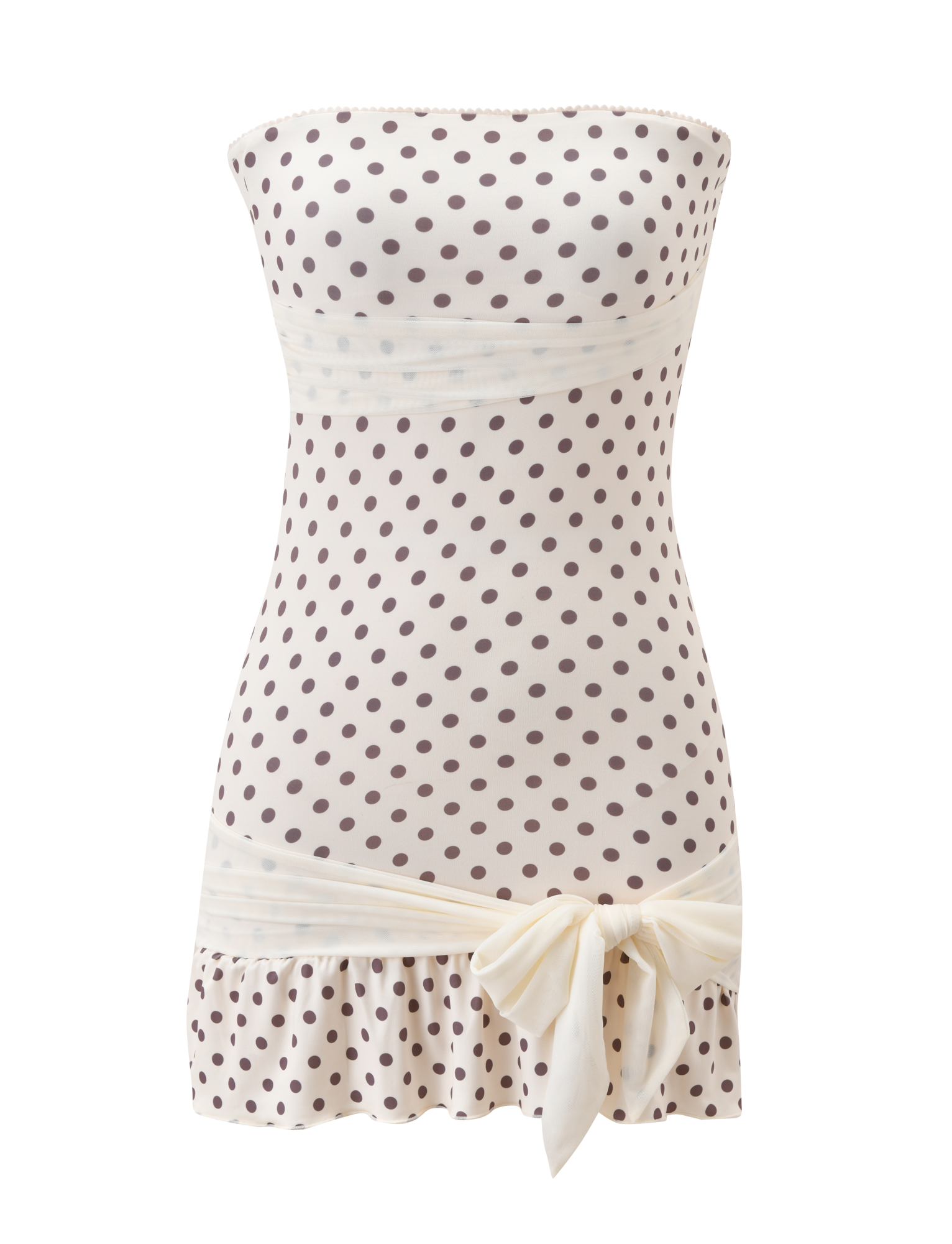 The TOVE MINI DRESS by TIGERMIST features a strapless white bodycon silhouette with brown polka dots, a ruched waist, playful ruffle hem, and a large cream bow at the hip. Displayed on a white background.