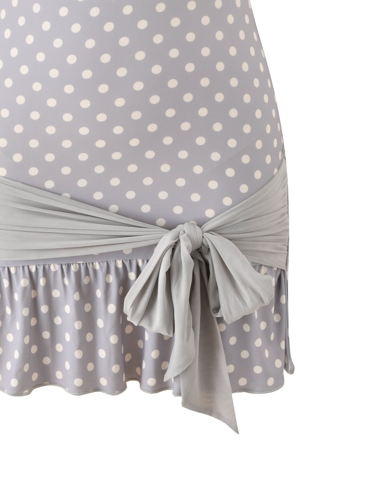 Close-up of the TIGERMIST TOVE MINI DRESS in dove grey with cream dots, featuring a strapless design, ruffle hem, and matching fabric belt tied at the waist.