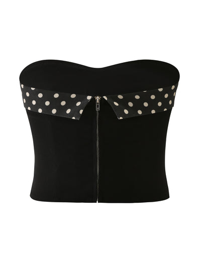 The TIGERMIST KITTIE 2.0 BUSTIER - BLACK features a strapless sweetheart neckline, front zipper, wide fold-over collar, and black-and-white polka dot stretch suiting fabric for both comfort and style.
