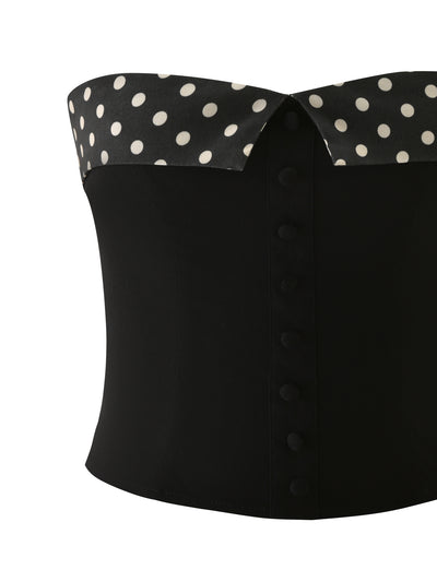 The TIGERMIST KITTIE 2.0 BUSTIER - BLACK features a strapless sweetheart neckline, black and white polka dot collar, matching fabric-covered buttons, and is crafted from sleek stretch suiting fabric for a perfect fit.