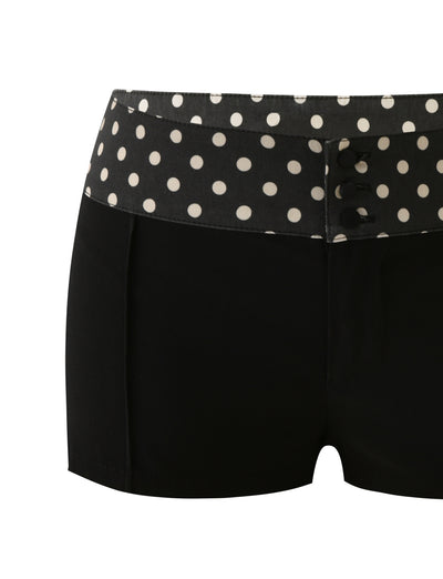 The TIGERMIST KITTIE 2.0 SHORT - BLACK features a soft Kittie fabric, black mini cut, polka dot waistband, decorative front buttons, and a chic white polka dot pattern on a plain white background.