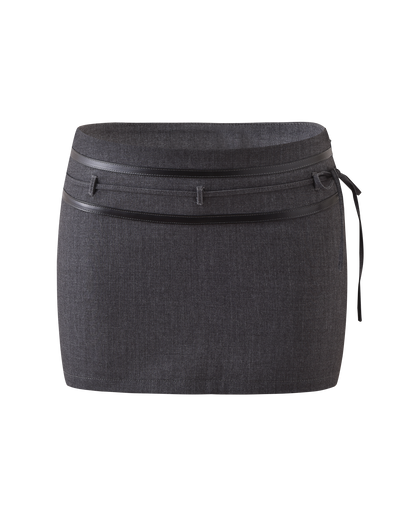 The TIGERMIST FEDRA SKORT - GREY is a dark gray, high-waisted mini skort featuring a double waistband, belt loops, and a slim matching belt knotted on the right side, shown against a plain white background.