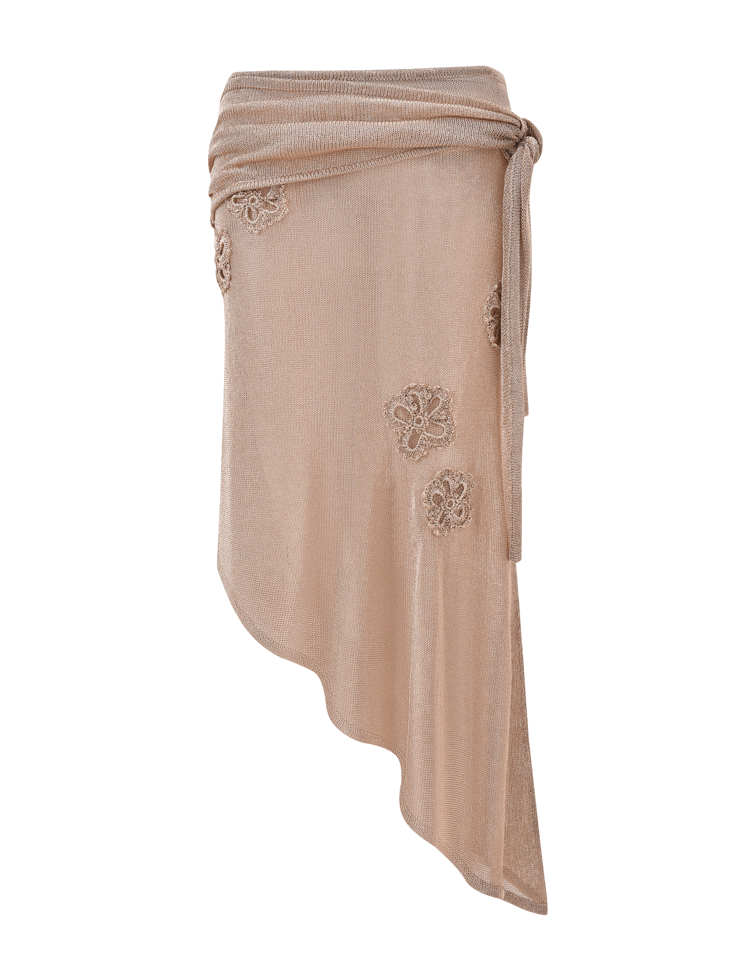 The ISATANA SKIRT - GOLD by TIGERMIST is a beige asymmetrical wrap skirt featuring a waist tie and floral lace appliqués on the front, showcased against a plain white background.