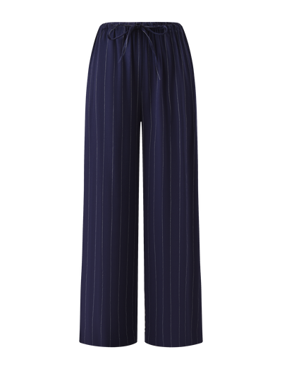 The LAINEY PANT - NAVY PINSTRIPE by TIGERMIST features a wide-leg silhouette, elasticated waist, and front drawstring for effortless style and comfort.