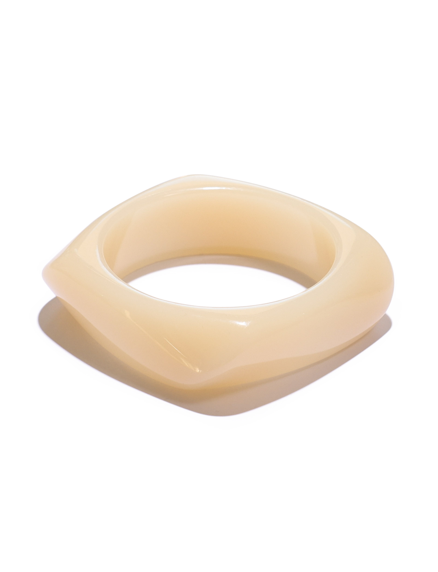 The TIGERMIST TIA CHUNKY 2PC RESIN BANGLE SET in cream and blue features modern, asymmetrical chunky bangles with a smooth, glossy finish, shown against a white background.