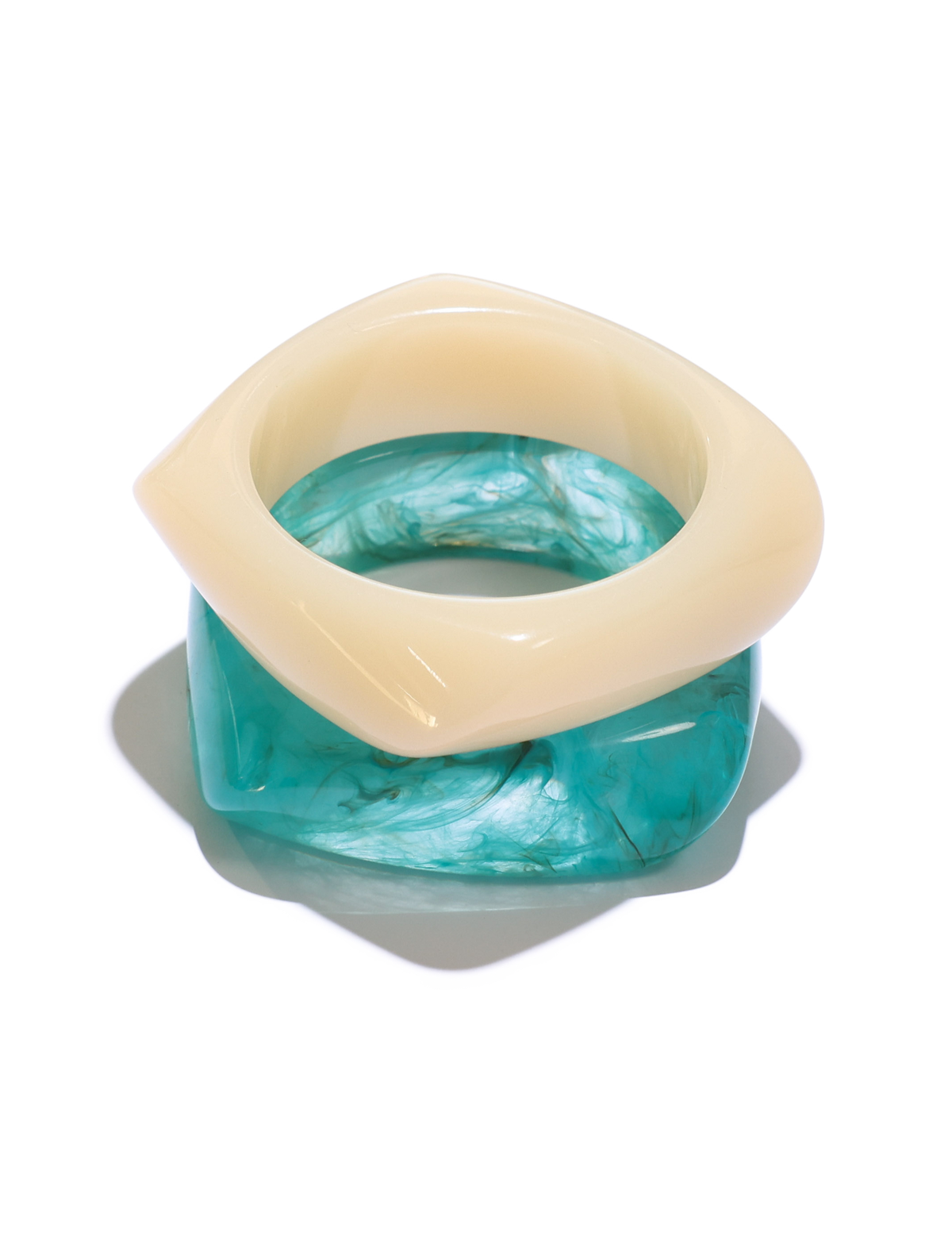 The TIGERMIST TIA CHUNKY 2PC RESIN BANGLE SET features a turquoise, marble-effect square-edge bangle and a glossy cream, diamond-shaped bangle—both displayed on a crisp white background.