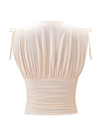 The HALONA TOP - CREAM by TIGERMIST features a sleeveless back view, adjustable shoulder ties, gathered fabric at the shoulders and waist, and a soft, elegant drape.