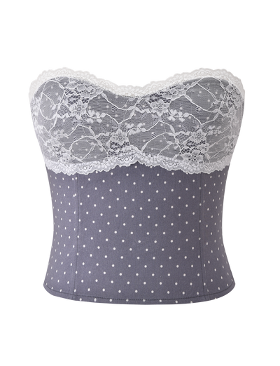 The KITTIE LACE CORSET - GREY DOT by TIGERMIST is a strapless top in grey and white polka dots, finished with a scalloped white lace trim along the sweetheart neckline.