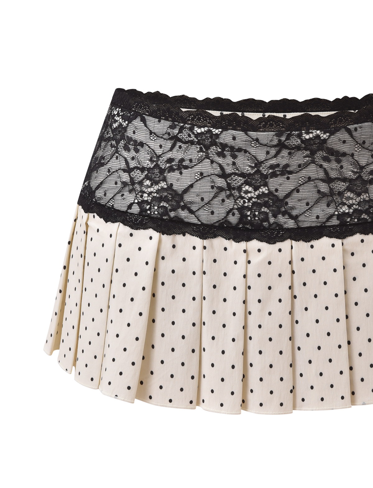 The TIGERMIST KITTIE LACE SKORT - CREAM DOT is a cream pleated mini skort with black polka dots and a wide black lace waistband, shown against a white background.