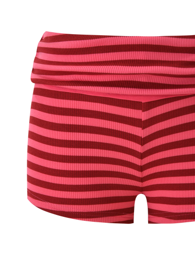 The TIGERMIST CERYS RIB SHORT - PINK RED STRIPE features red and pink horizontal stripes, a ribbed knit texture, and a wide foldover waistband, shown against a plain white background.