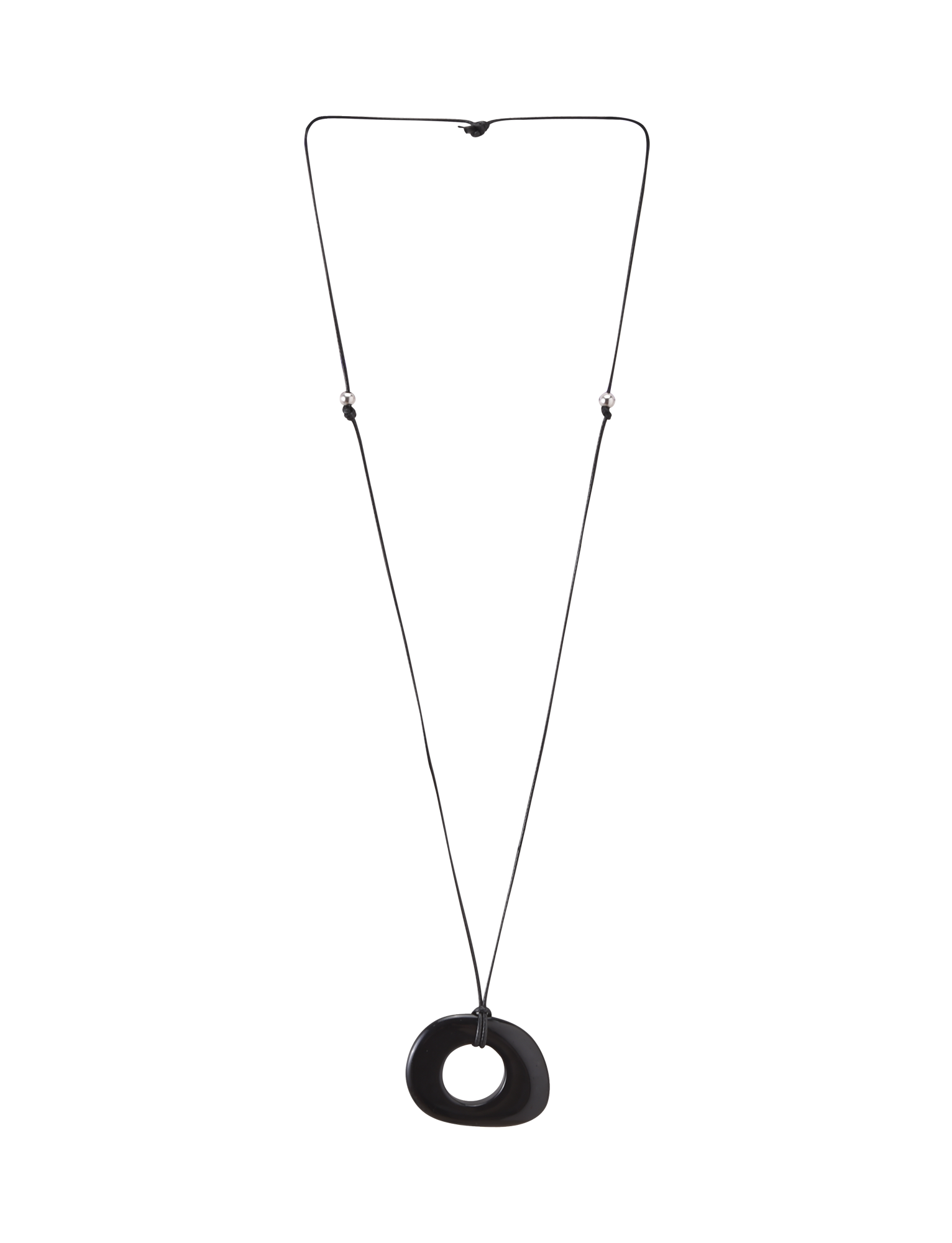 The FAELLA PENDANT NECKLACE - BLACK by TIGERMIST features a long, thin adjustable cord with two small beads and a large smooth black resin pendant with an off-center hole, shown against a plain white background.