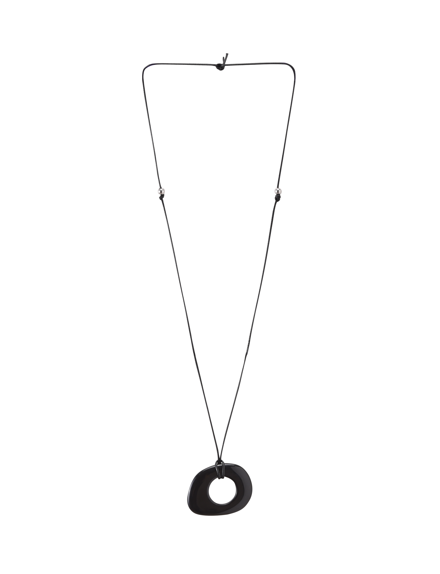 The FAELLA PENDANT NECKLACE - BLACK by TIGERMIST features a minimalist, irregular black resin pendant with a central hole on an adjustable cord, shown against a plain white background.