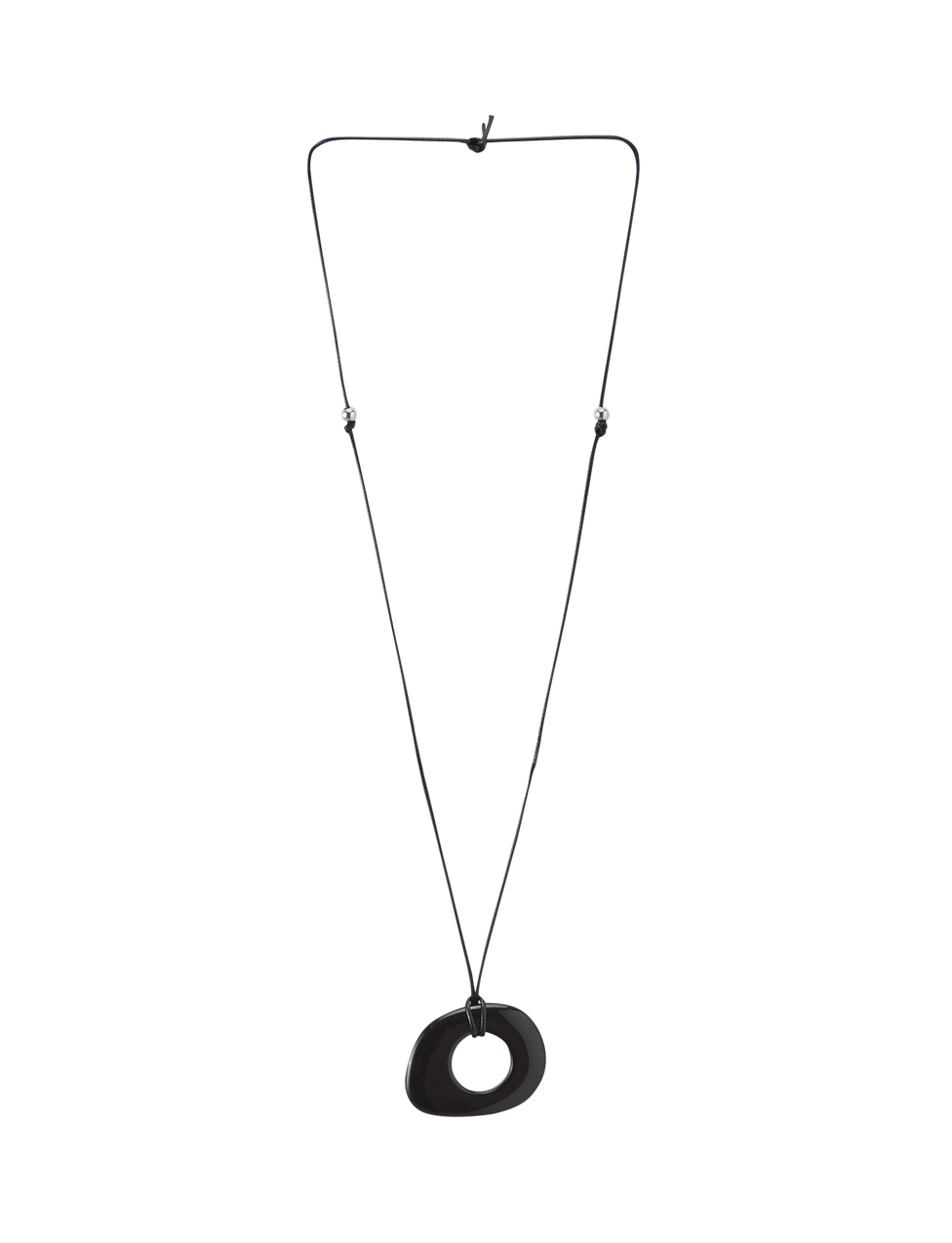 The FAELLA PENDANT NECKLACE - BLACK by TIGERMIST features a minimalist, irregular black resin pendant with a central hole on an adjustable cord, shown against a plain white background.