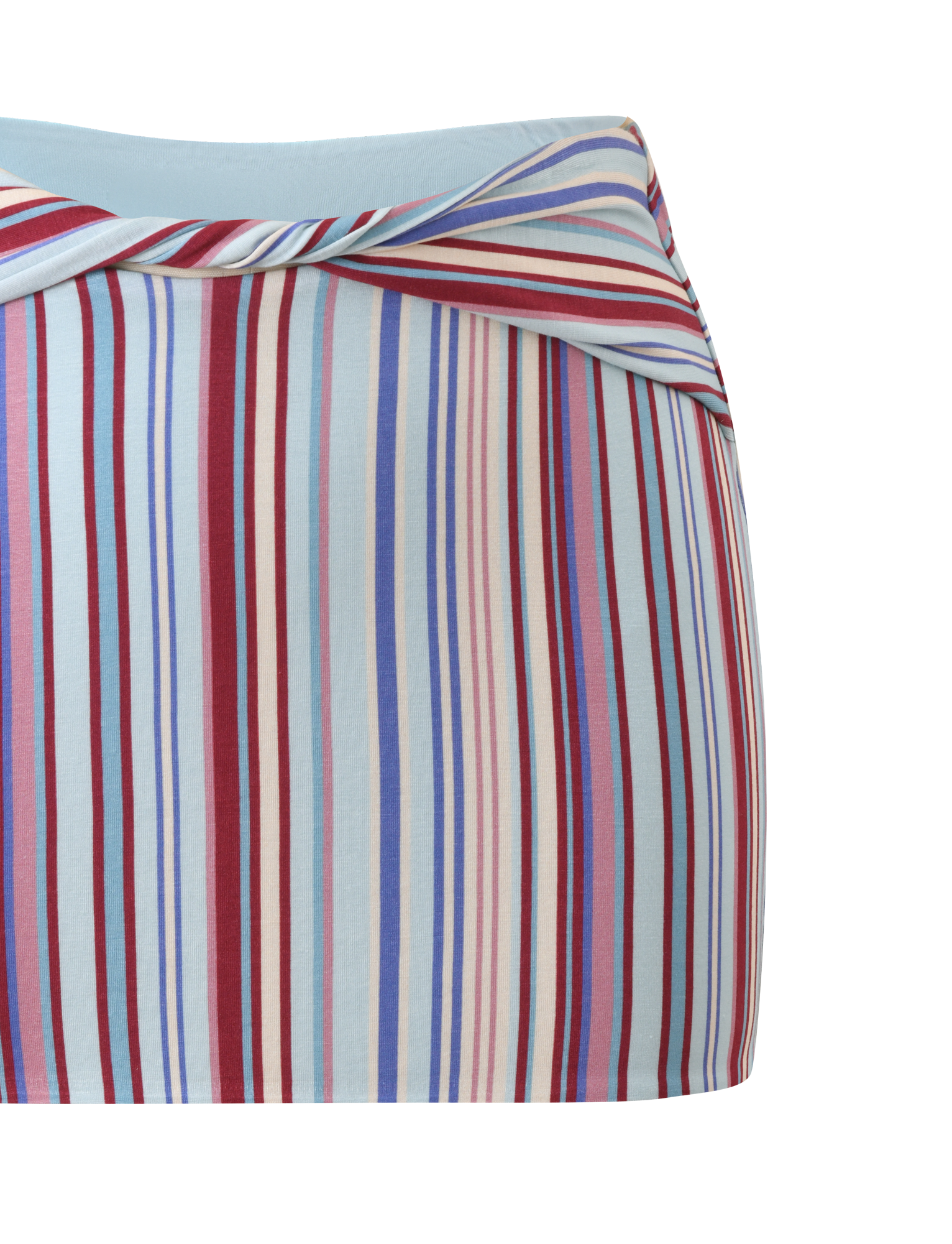 A close-up of the TIGERMIST HAZE TWIST SKIRT - VARIEGATED STRIPE, a fitted mini skirt with a diagonal waistband and vertical red, blue, purple, and white stripes on light blue. Soft, stretchy fabric ensures comfort.