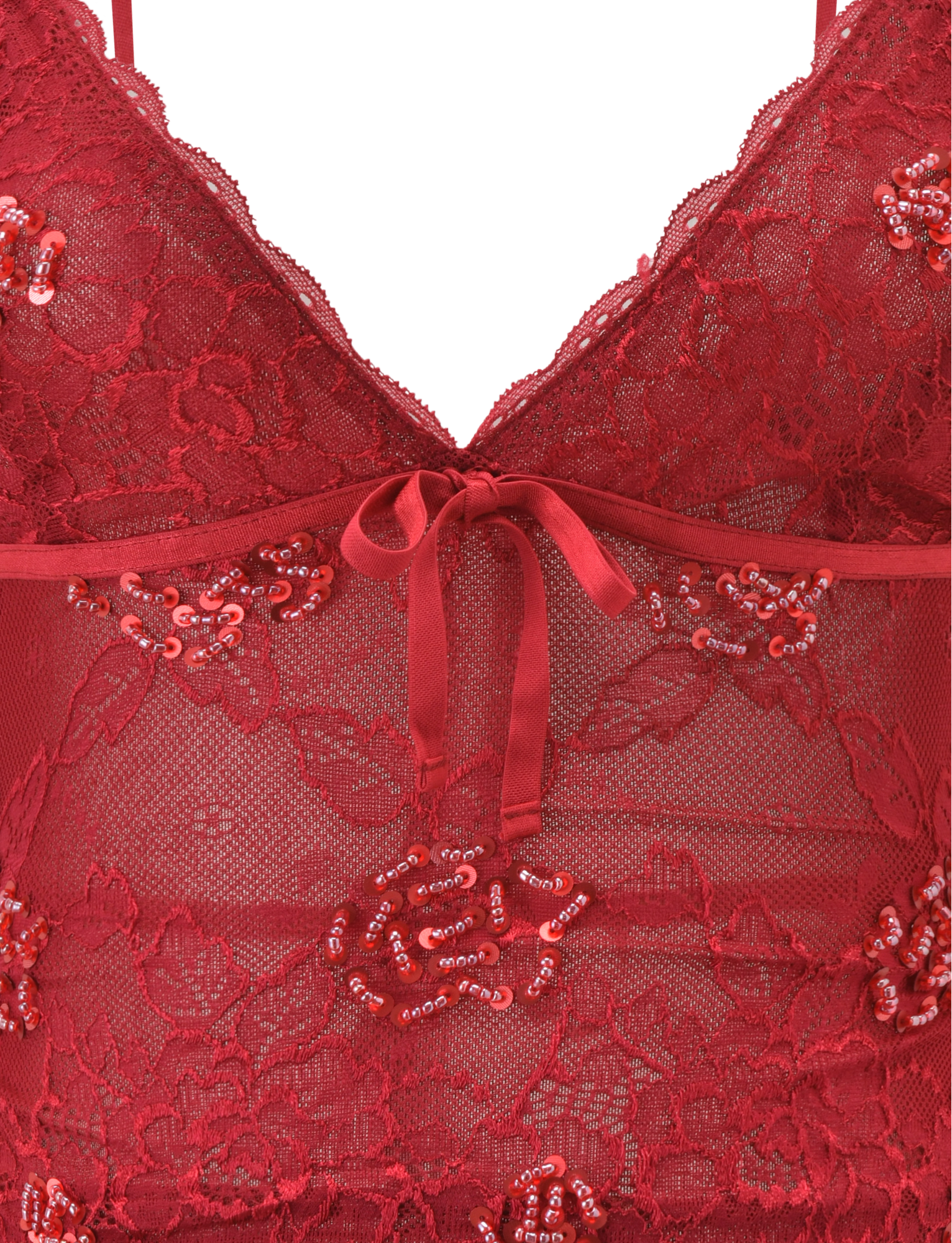 Close-up of the TIGERMIST KIRRA BEADED SEQUIN LACE TOP in red, featuring delicate floral lace, shimmering beads and sequins, plus a satin ribbon bow at the center front.