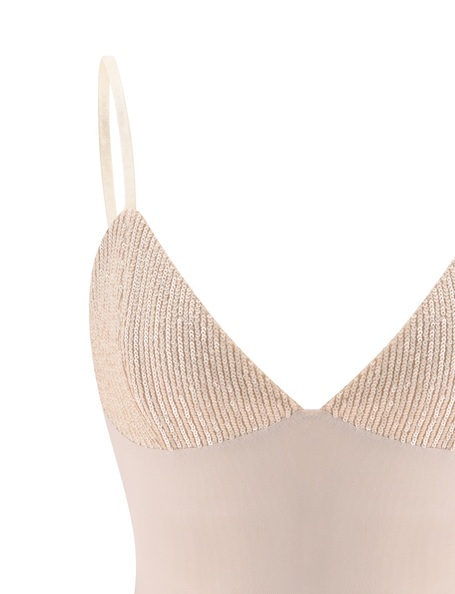 The SYLA TOP - OAT by TIGERMIST is a beige seamless camisole featuring adjustable shoulder straps and fine, delicate bands. Its upper section showcases a textured, ribbed knit that flows into a smooth lower fabric—making it a versatile summer essential.