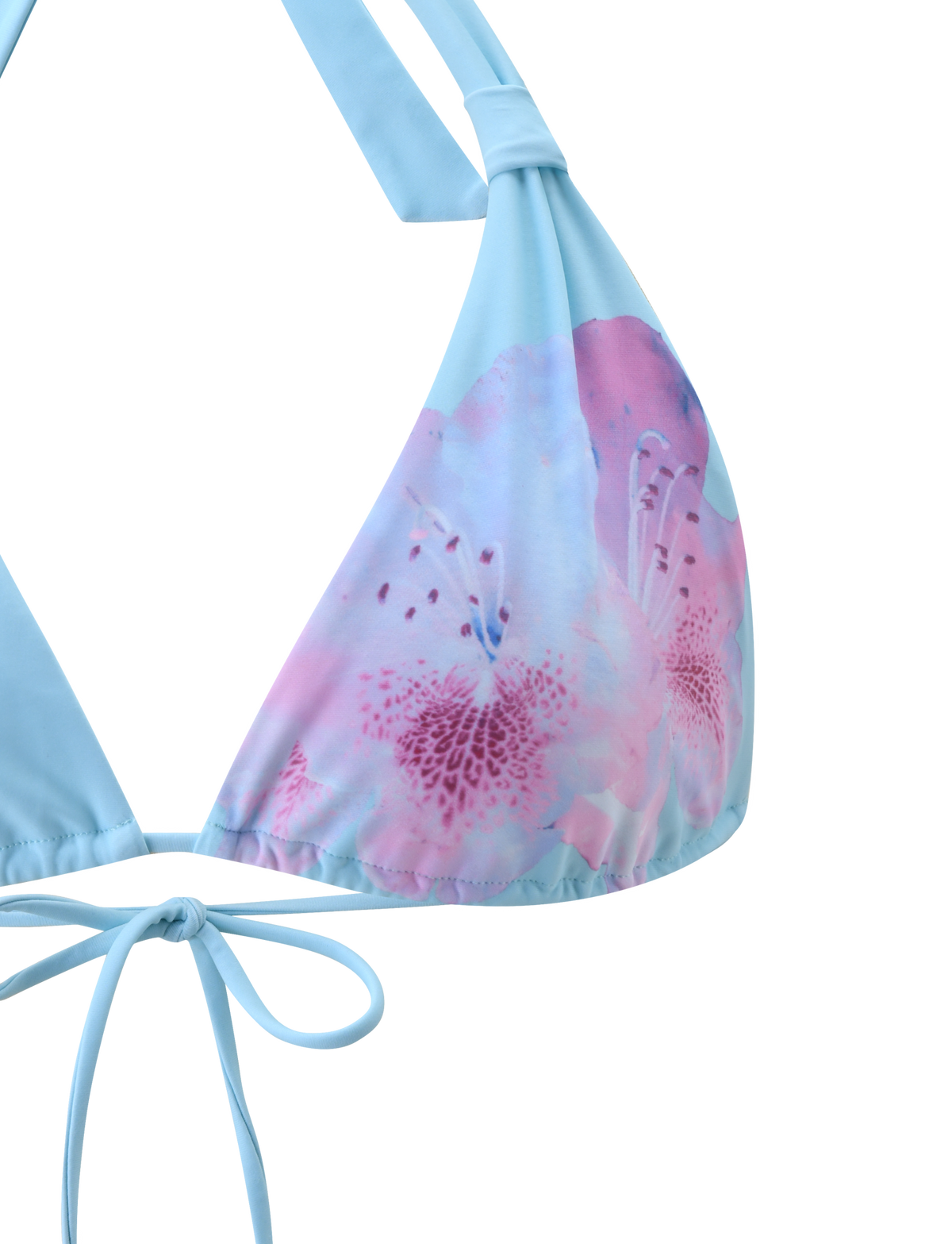 Close-up of the SID BIKINI TOP - BLUE by TIGERMIST, featuring a floral print with a light blue top, pink and purple accents on one cup, and adjustable halter neck and tie-back straps against a plain background.