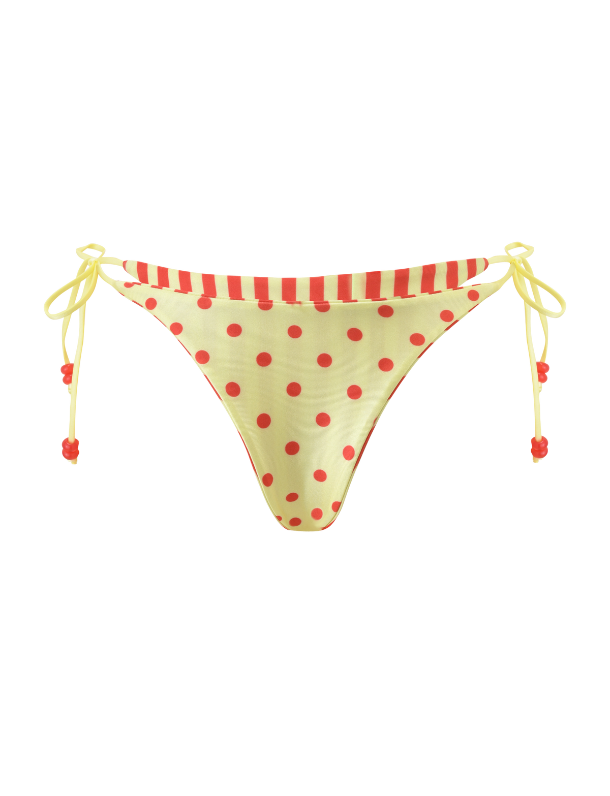 The TIGERMIST FINLEA REVERSIBLE BIKINI BOTTOM features a yellow polka dot print with a cheeky cut, red striped waistband, and yellow side ties with red beads, shown on a plain white background.